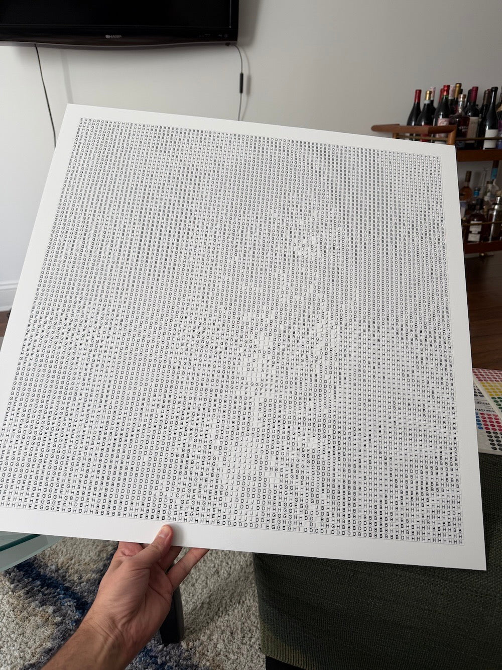 A close-up of the printed numbered grid on rigid foam board — every circle has a clear letter inside.